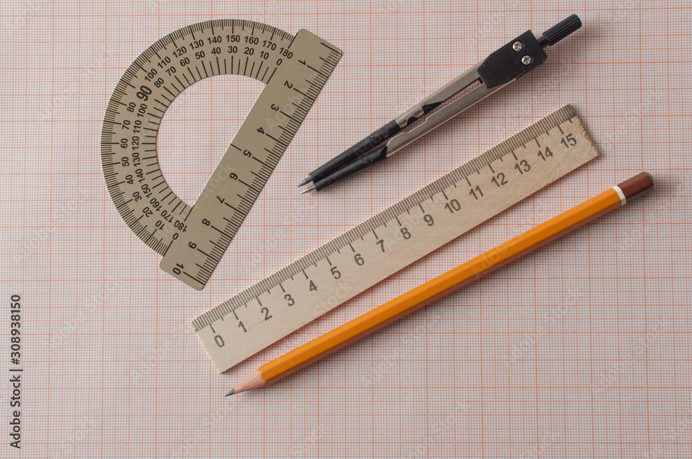 Geometry set with compass,pencil,ruler on graph paper Geometry set with compass,pencil,ruler on graph paper