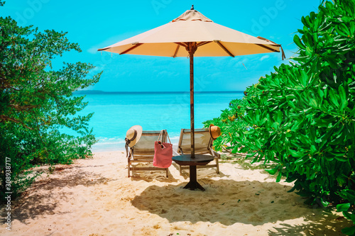 Two beach chairs on tropical vacation  relax at sea