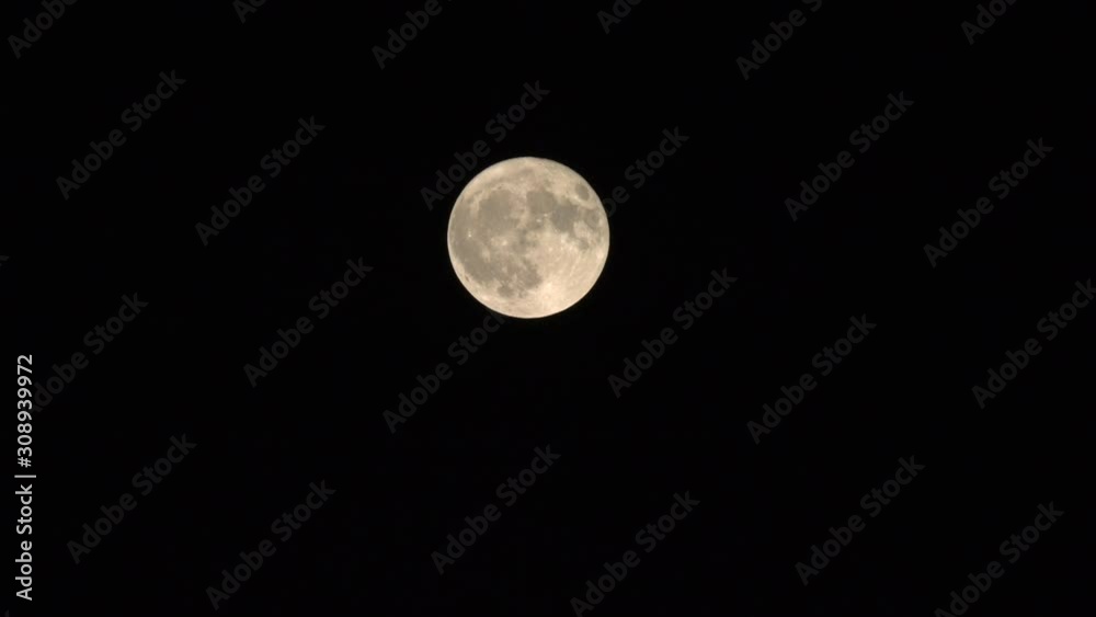 A Beautiful Scenery Of A Full Moon Surrounded By Black Sky in Canada - Wide Shot A Beautiful Scenery Of A Full Moon Surrounded By Black Sky in Canada - Wide Shot