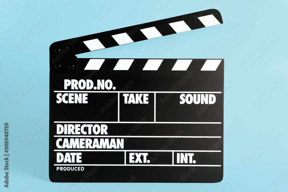 Clapper board on light blue background. Cinema production