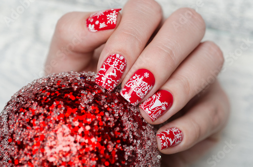 Canvas Print red Christmas manicure with deer and snowflakes and Norwegian pattern with Chris