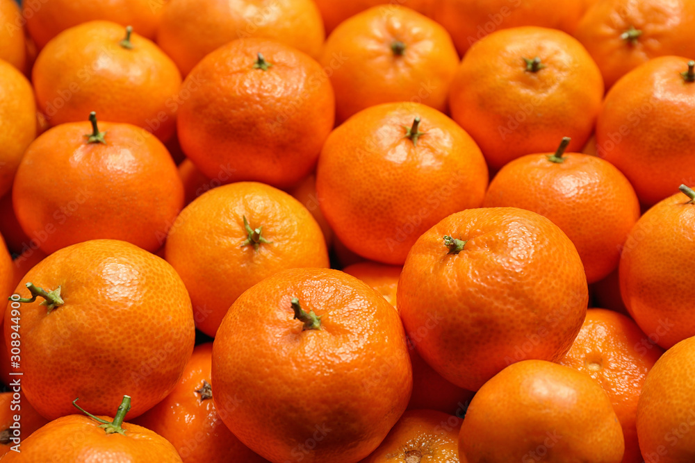 Delicious fresh ripe juicy tangerines as background Delicious fresh ripe juicy tangerines as background