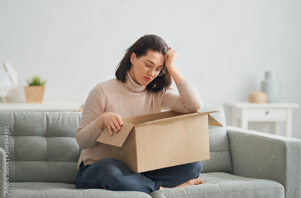 woman is holding cardboard box woman is holding cardboard box
