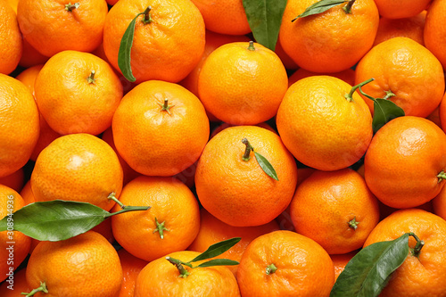 Delicious fresh ripe tangerines as background, top view