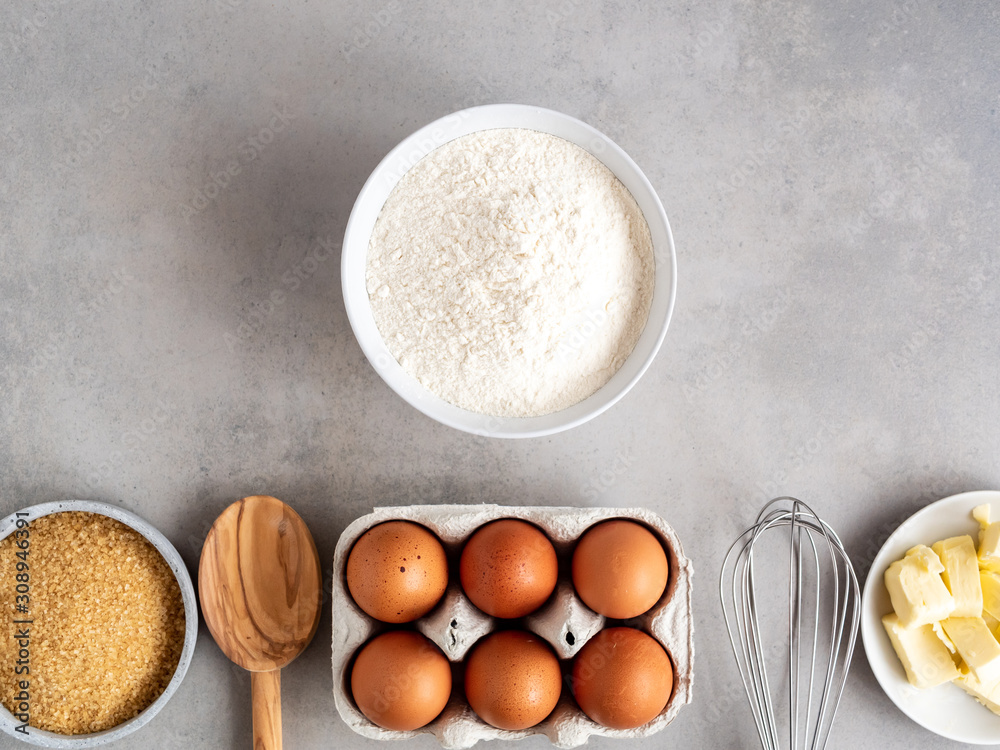 Zutaten für eine Kuchen auf einem grauen Hintergrund, Flat lay