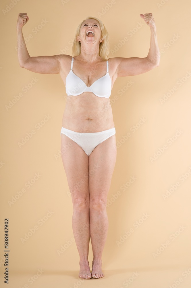 Naklejka premium Woman showing her biceps