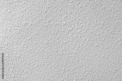 white colored low contrast Concrete textured background with roughness and irregularities to your design or product.