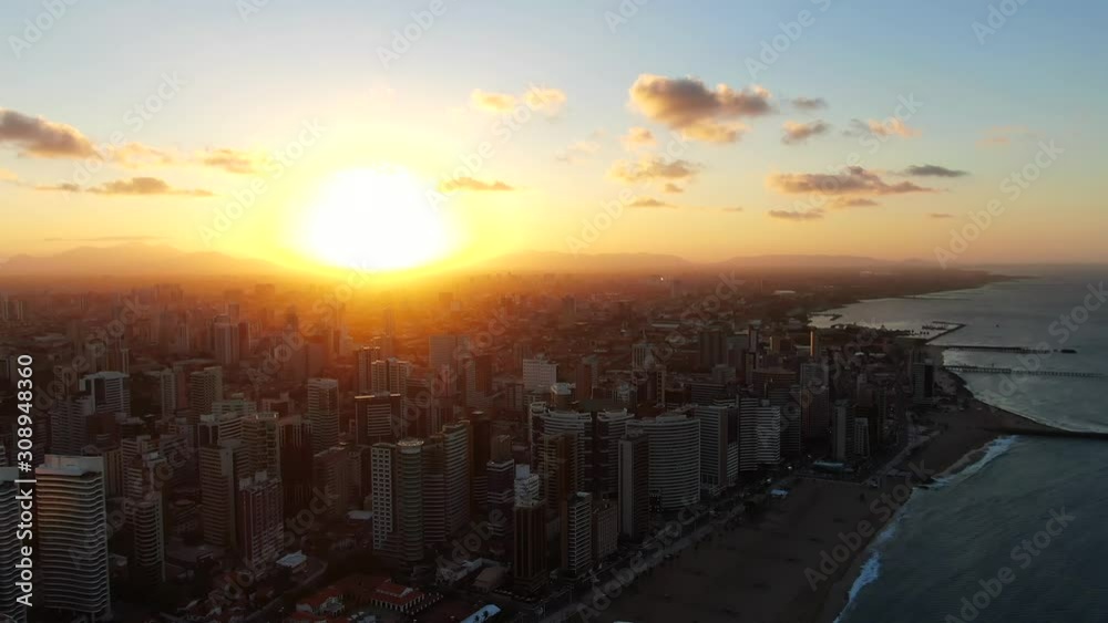 Aerial view of city Fortaleza. Luxury resorts and hotels, skyscrapers on the coast line. Beautiful beaches. City view during sunset. Aerial view of city Fortaleza. Luxury resorts and hotels, skyscrapers on the coast line. Beautiful beaches. City view during sunset.