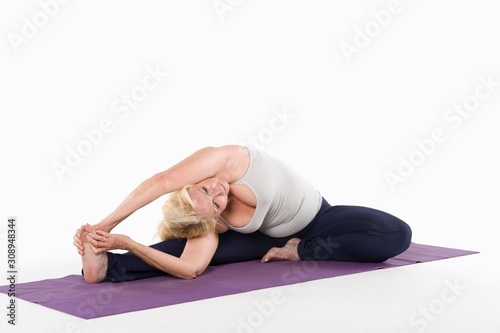 Woman stretching while doing yoga