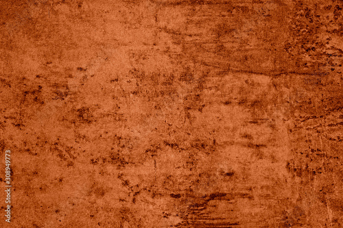 Saturated orange colored low contrast Concrete textured background with roughness and irregularities. 2020 color trend.