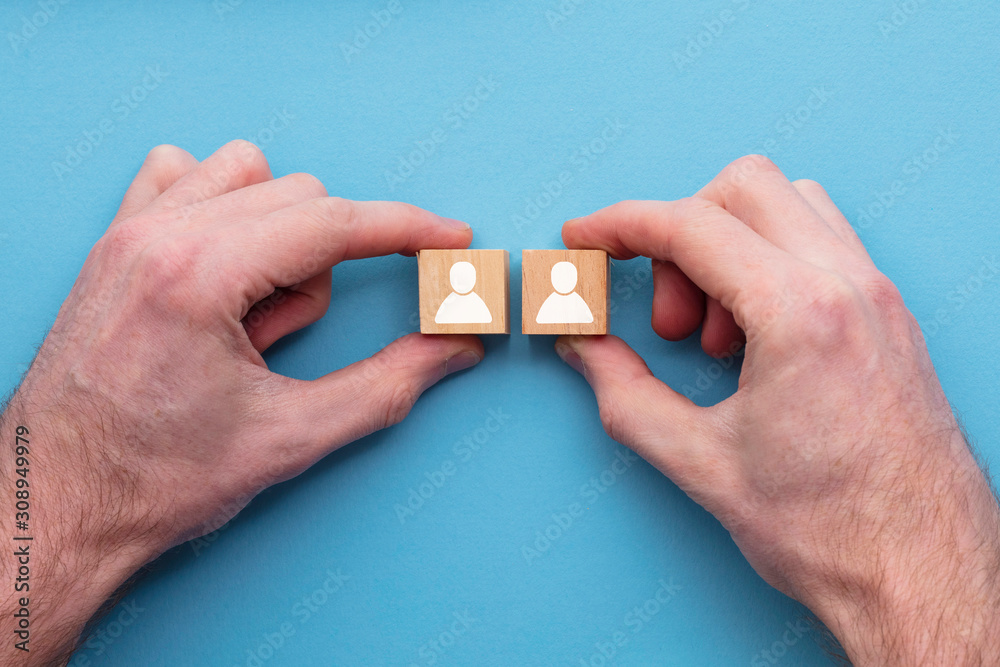 Hand choosing one person from another. Business choice concept Hand choosing one person from another. Business choice concept