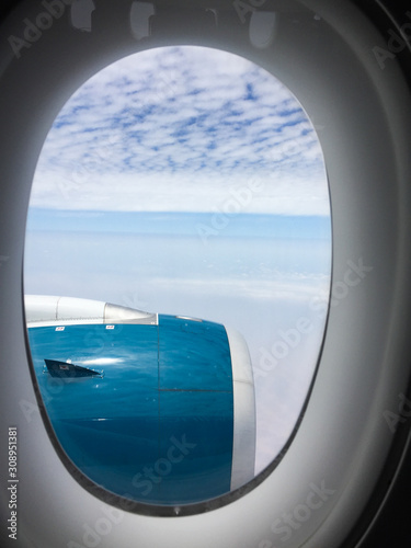 Blue engine of passenger airplane in the sky