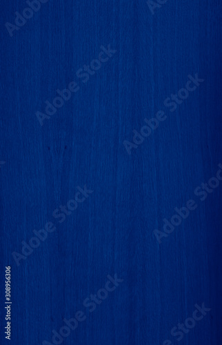 wooden background toned in trendy Classic Blue color of the Year 2020