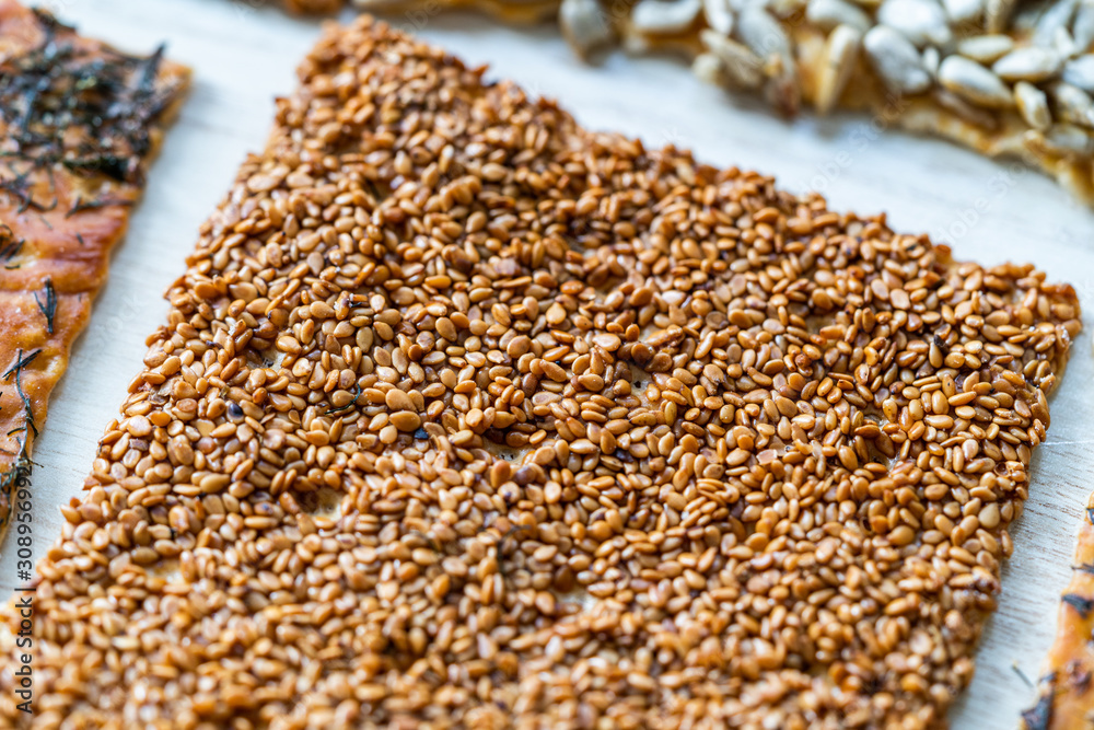 Turkish Homemade Snacks Biscuit with Sunflower Seeds, Sesame and Dill /Crispy Yaprak Galeta with Traditional Tea on Tray. Turkish Homemade Snacks Biscuit with Sunflower Seeds, Sesame and Dill /Crispy Yaprak Galeta with Traditional Tea on Tray.