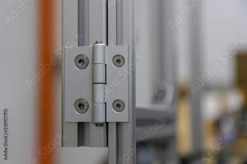 Aluminium door panel with an Aluminium hinge.