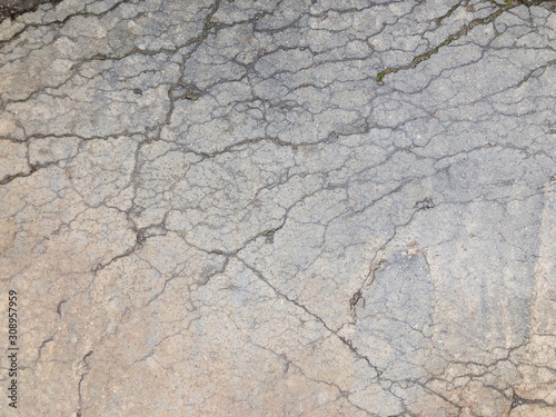 Cracked concrete texture closeup background