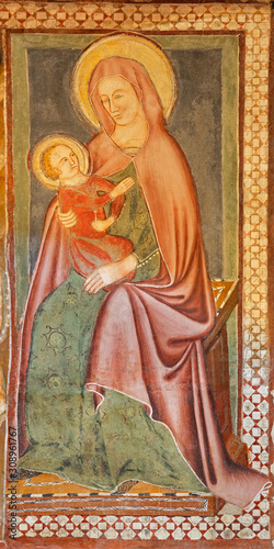 COMO, ITALY - MAY 8, 2015: The detail of medieval fresco of Madonna in church Basilica di San Fedele.