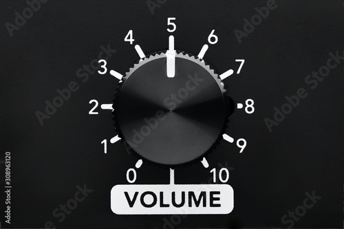 Volume control knob of a black amplifierwith dial numbers