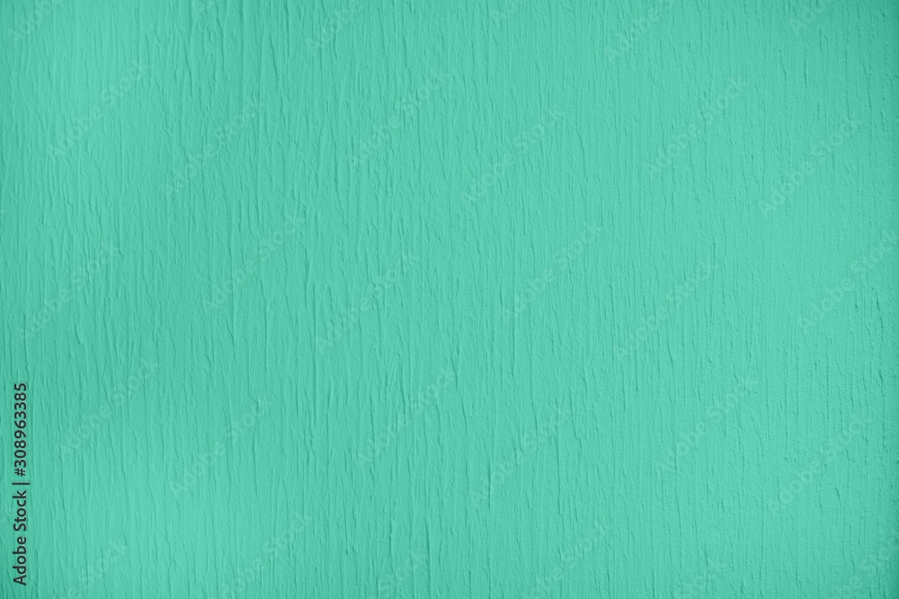 Fototapeta premium Trendy mint colored low contrast Concrete textured background with roughness and irregularities to your design or product. Color trend concept.