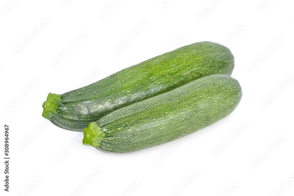 whole unpeeled fresh zucchini on white background whole unpeeled fresh zucchini on white background