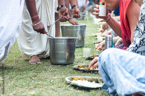 Indian pilgrims are going to eat sacred food called Prasadam - this is an important part of the ritual of worship of the Lord Jagannath.