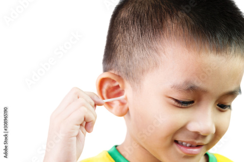 Child boy an 5 years old holding cotton swab stick for ear cleaning on white background.