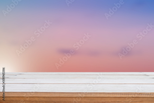 Empty wood table top on blur nature background.