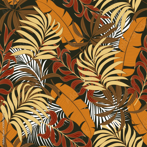 Botanical seamless tropical pattern with bright red and yellow plants and leaves on a black background. Beautiful seamless vector floral pattern. Beautiful exotic plants. 