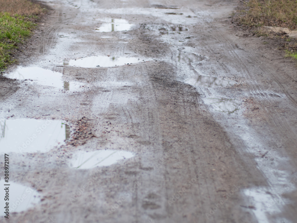 Bad quality road in rural region of city Bad quality road in rural region of city