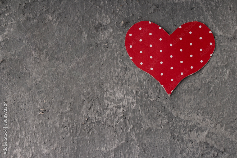 Red heart symbol of love on the old wall texture