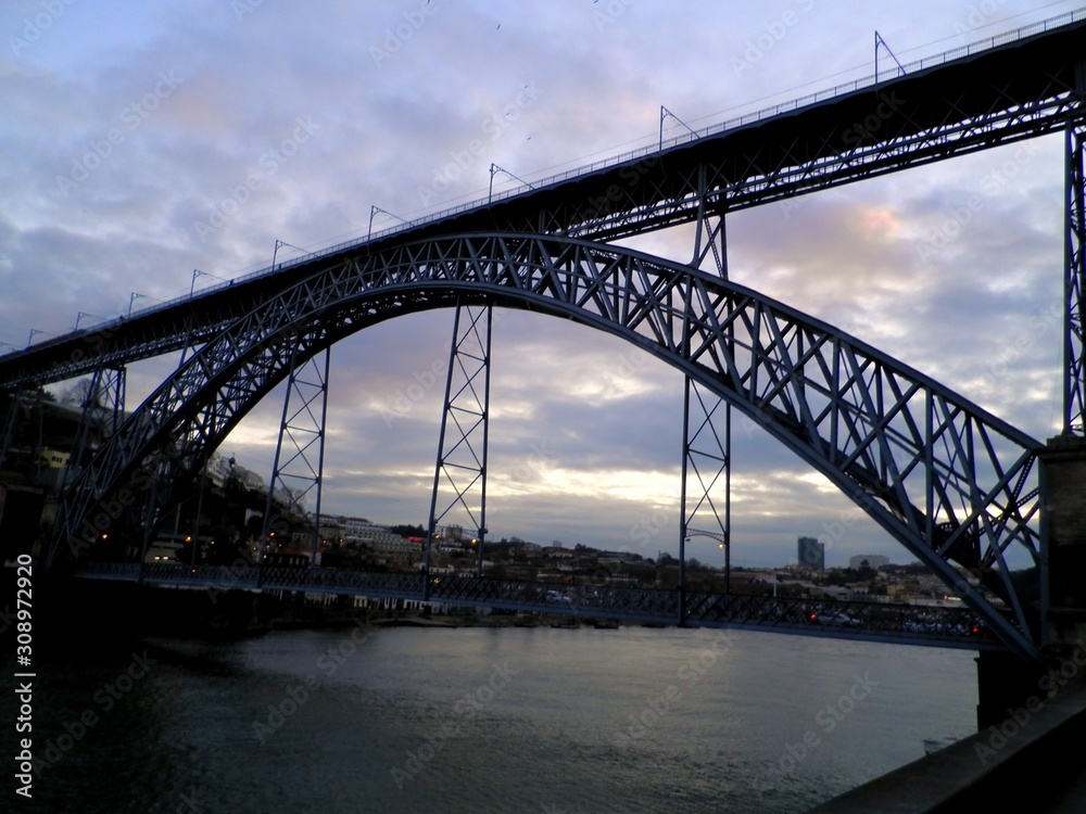 Porto, northwest of Portugal, at the mouth of the Douro River.  Narrow cobblestone streets and towering bridges