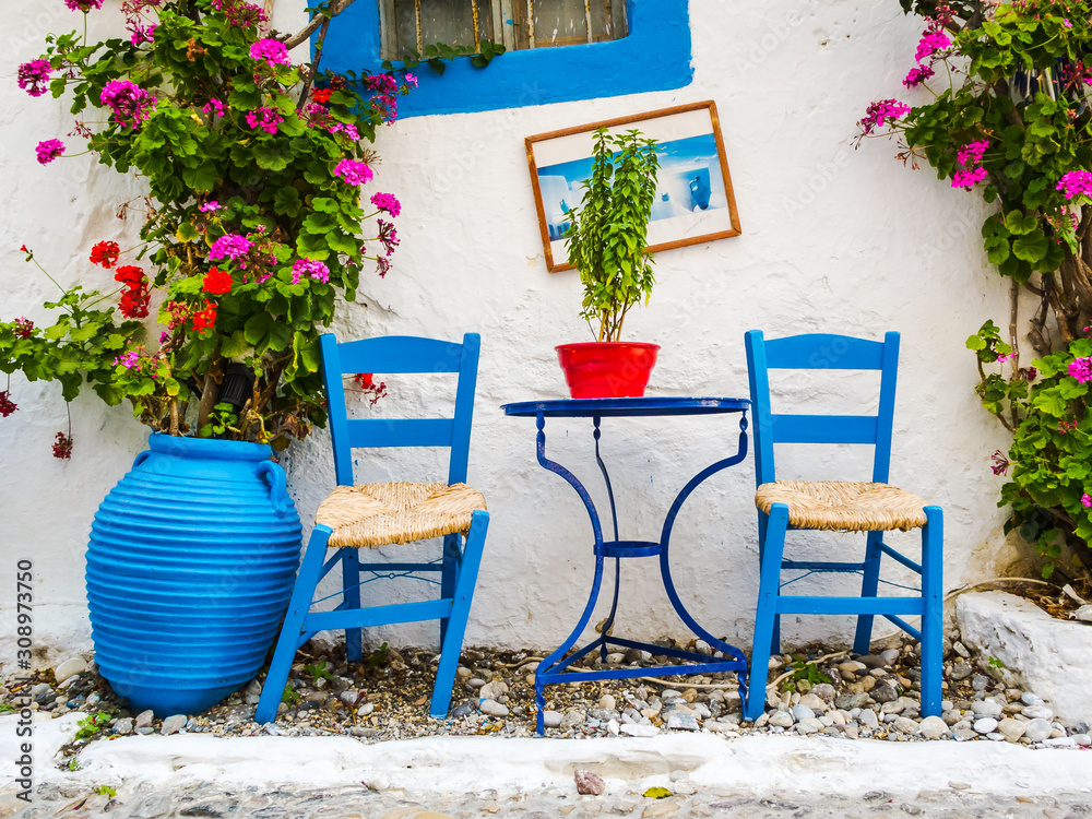 Fototapeta premium Greece: Typical Greek Blue Chairs and Table in a small Cafeteria