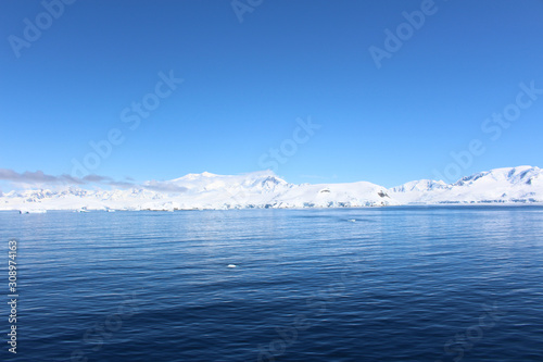 Snow-capped mountains on an island along the coasts of the Antarctic Peninsula  Palmer Archipelago  Antarctica