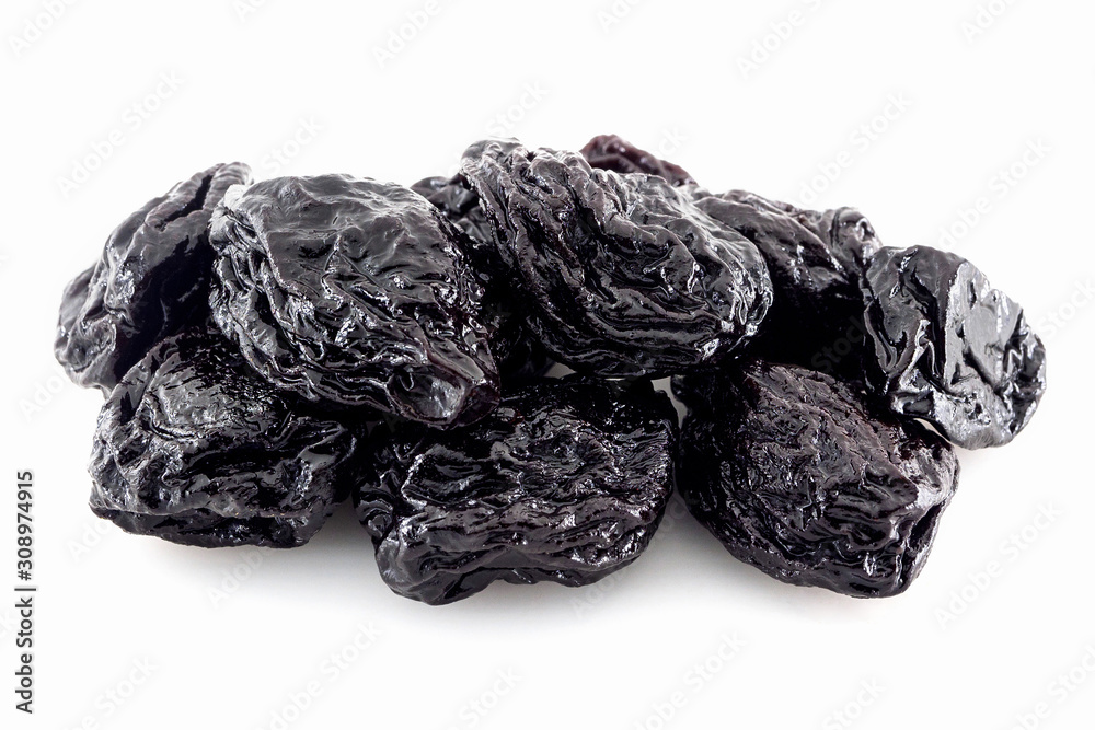 Juicy dried prunes on a white background Juicy dried prunes on a white background