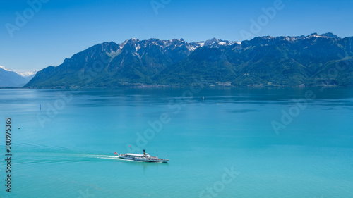 Fototapeta Naklejka Na Ścianę i Meble -  A vintage paddle wheel boat cruises from Montreux on Lake Geneva