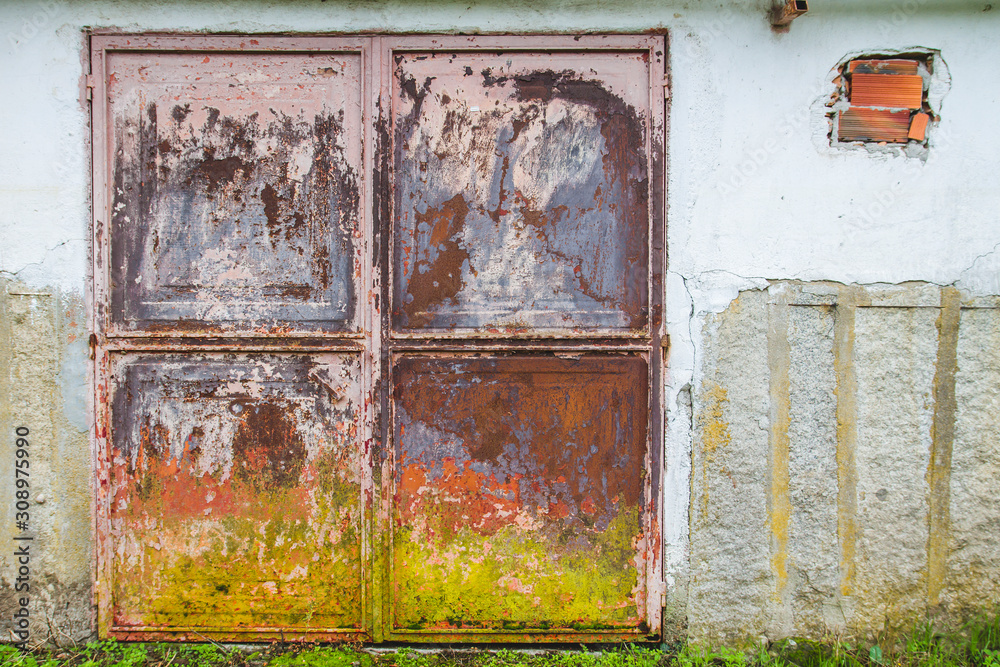 OLd rusted metallic gate with peeled paint OLd rusted metallic gate with peeled paint
