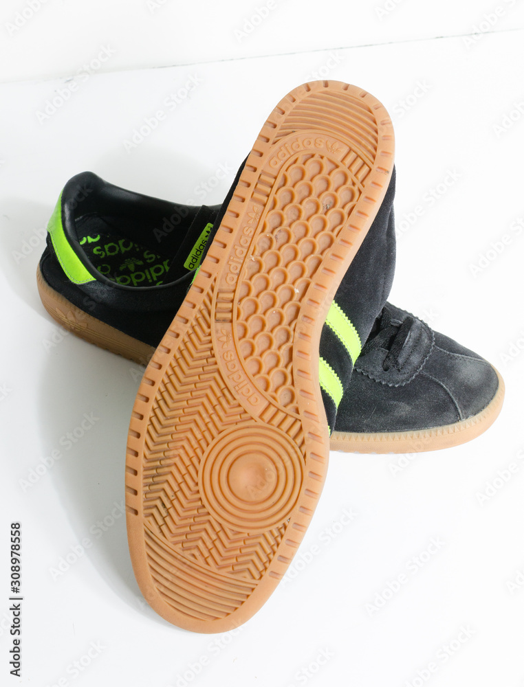 london, england, 05/05/2018 Adidas Originals Bermuda Core Black Green Gum  Casuals Not Malmo Dublin Trainers vintage sneaker trainers. stylish retro  football street fashion. adidas gum sole foto de Stock | Adobe Stock