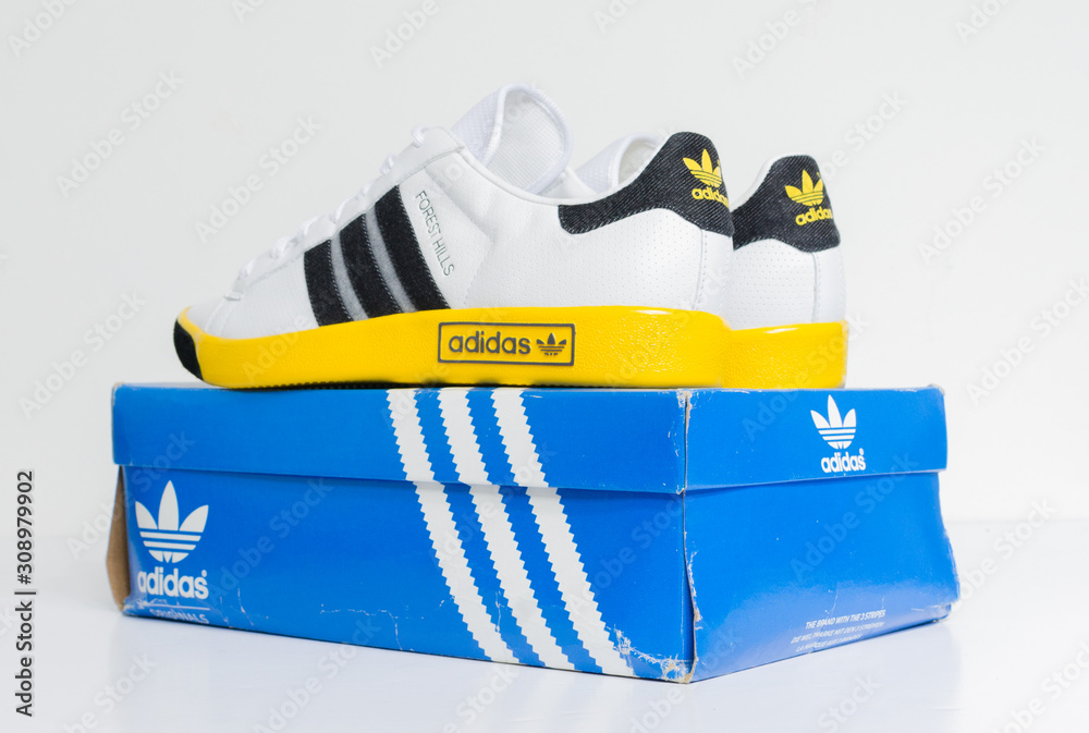 london, england, Adidas Forest Hills Vin White DK Grey/Sunshine vintage sneaker trainers. Blue suede adidas trainers, stylish retro football street fashion. famous three stripes Stock Photo | Stock