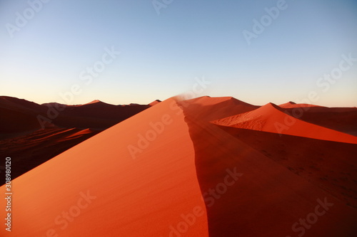 Huge Red sand dunes in Sossusvlei desert in Namibia in the sunrise