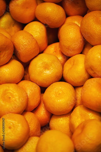 Healthy fruits  mandarin fruits background. Orange fruit background. Mandarin fruits at market store