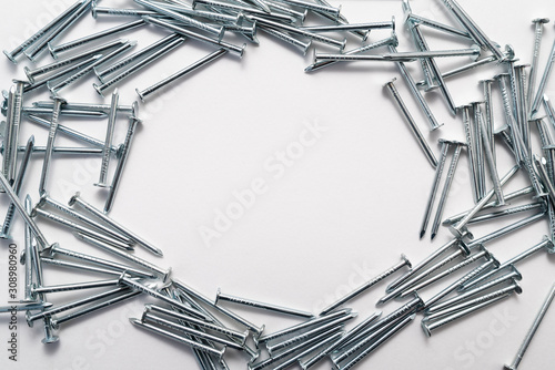 construction metal nails on white background