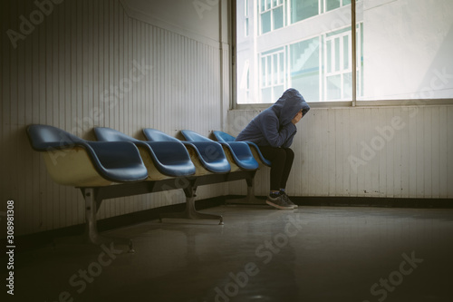 Sad Asia woman sitting at stair case.Depression and problem concept.