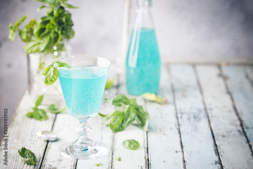Colorful refreshing summer drink with basil seeds on light background. Colorful refreshing summer drink with basil seeds on light background.