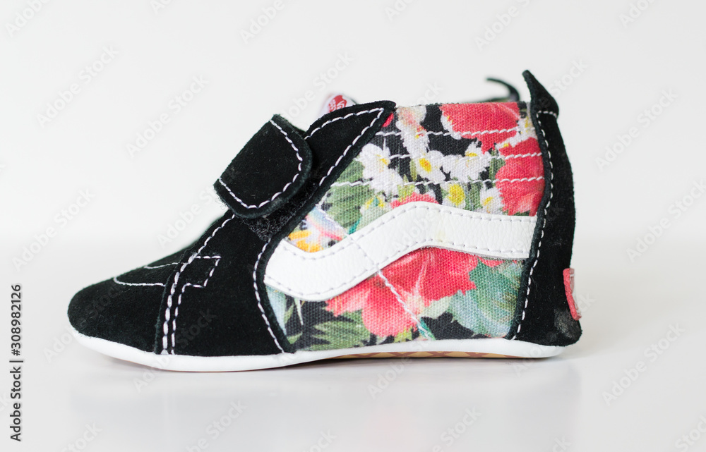 london, england, 05/08/2019 VANS SK8 HI CRIB newborn Babies Skate Shoes  Soft Sole, Black and flower floral print. trendy babies shoes. vans off the  wall baby shoes. Stock Photo | Adobe Stock