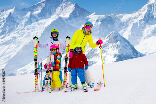 Ski and snow fun. Family in winter mountains.