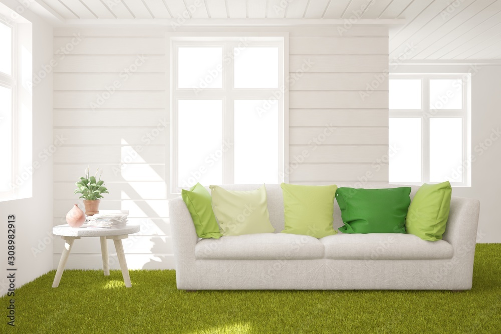 Fototapeta premium Stylish room in white color with sofa and grass floor. Scandinavian interior design. 3D illustration