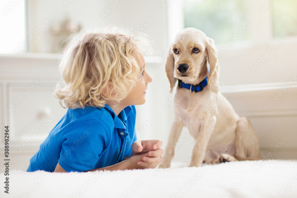 Child playing with dog. Kids play with puppy. Child playing with dog. Kids play with puppy.
