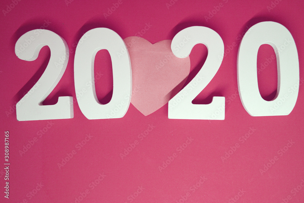 2020 number wooden with Heart paper object on pink background - Happy new year and Valentine Day 2020 concept 2020 number wooden with Heart paper object on pink background - Happy new year and Valentine Day 2020 concept