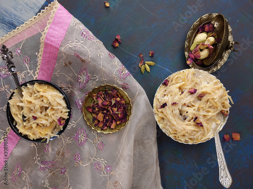 Seviyan or Vermicelli kheer, an Indian dessert made of semolina noodles topped with rose petals and dry fruits such as Cashews. photo