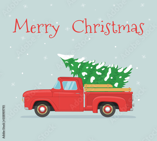 Old red retro pickup with christmas tree